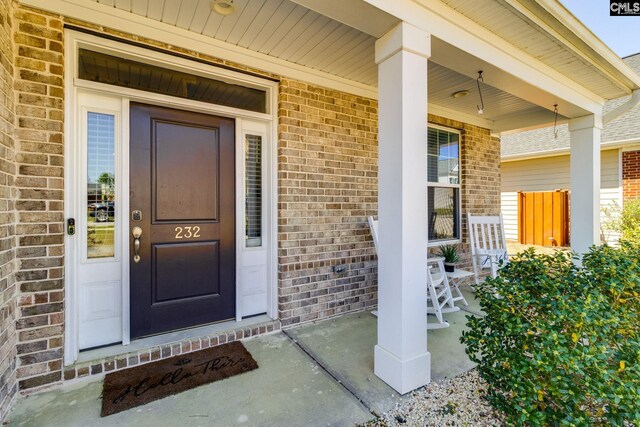 232 Compass Trl, Blythewood, SC 29016 - doorway to property with brick siding and a porch