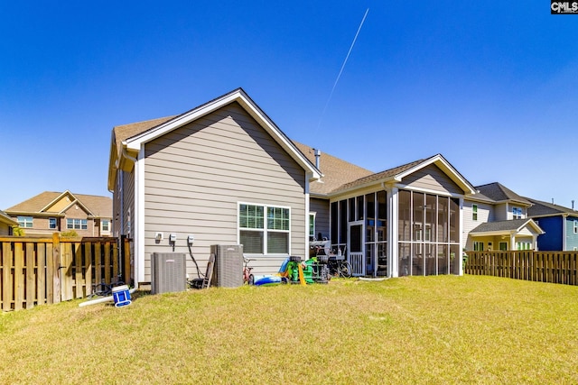 232 Compass Trl, Blythewood, SC 29016 - back of house with a fenced backyard, a sunroom, and a lawn