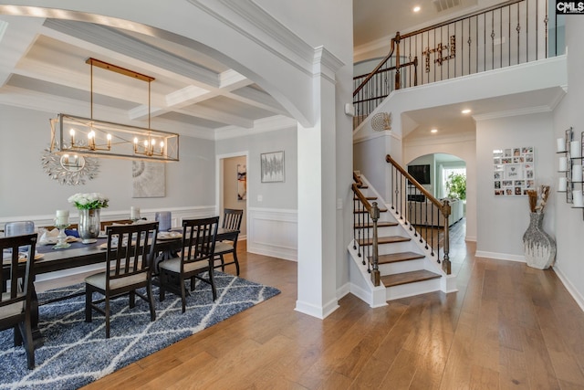 232 Compass Trl, Blythewood, SC 29016 - dining space with stairs, beamed ceiling, coffered ceiling, arched walkways, and wood-type flooring