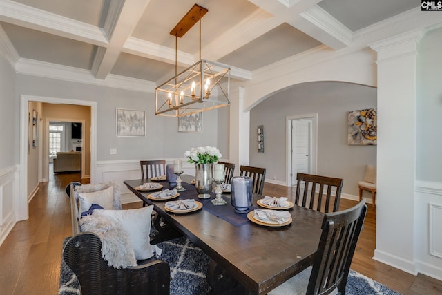 232 Compass Trl, Blythewood, SC 29016 - dining area with an inviting chandelier, beamed ceiling, coffered ceiling, arched walkways, and wood finished floors