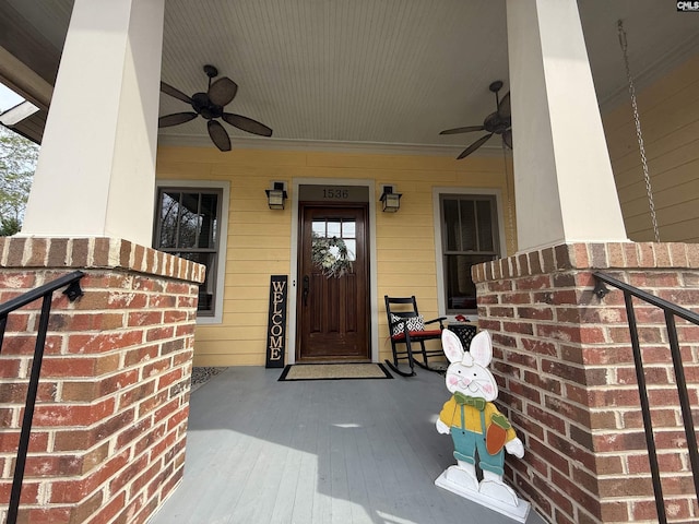 doorway to property with covered porch and ceiling fan