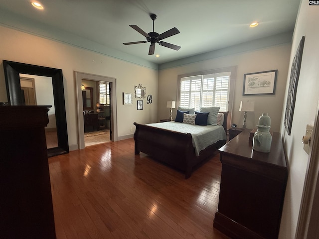 bedroom featuring recessed lighting, hardwood / wood-style flooring, multiple windows, and baseboards