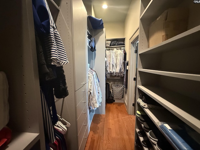 spacious closet featuring light wood-style flooring