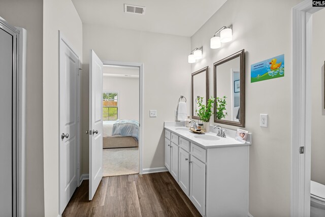 218 Secretariat St, Lexington, SC 29073 - ensuite bathroom featuring double vanity, visible vents, a sink, and wood finished floors
