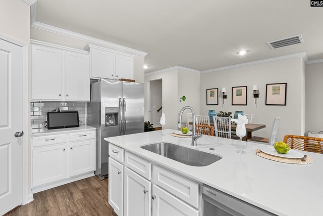 218 Secretariat St, Lexington, SC 29073 - kitchen with visible vents, dark wood-style flooring, light countertops, a sink, and stainless steel appliances