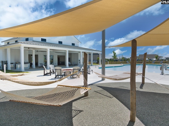 pool featuring ceiling fan and a patio