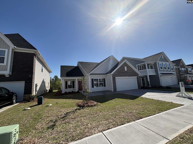 view of front of home with a front yard, driveway, and brick siding
