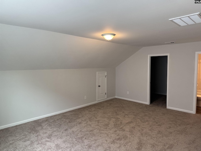 bonus room with baseboards, carpet flooring, and vaulted ceiling