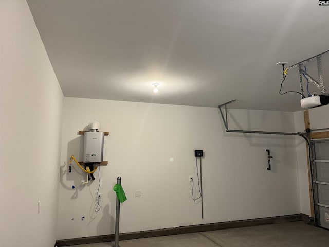 garage featuring water heater and a garage door opener