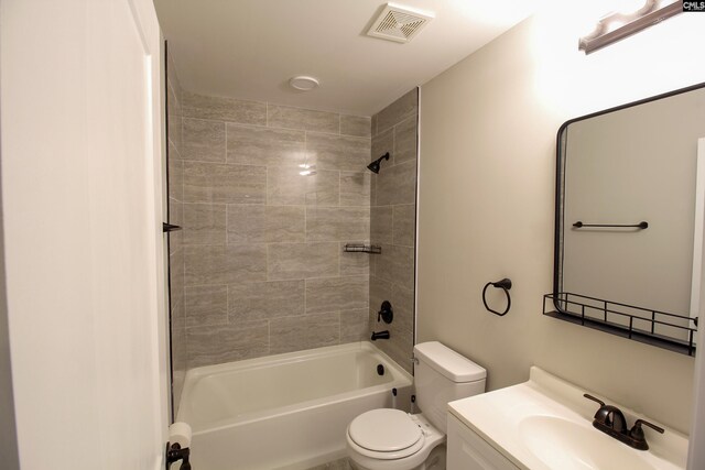 bathroom featuring toilet, tub / shower combination, vanity, and visible vents