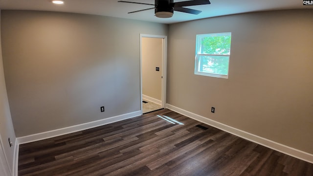 spare room with ceiling fan, baseboards, recessed lighting, and dark wood-style flooring