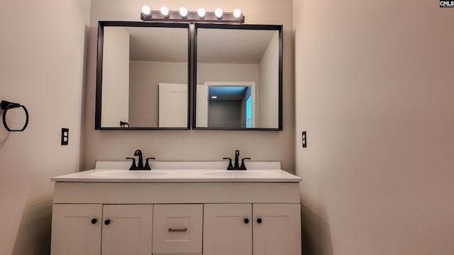 bathroom with double vanity and a sink
