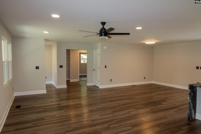 unfurnished living room with recessed lighting, dark wood-style flooring, baseboards, and a ceiling fan