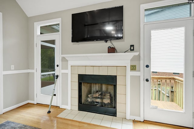 124 Pond Edge Ln, Chapin, SC 29036 - unfurnished living room with baseboards, lofted ceiling, hardwood / wood-style flooring, and a fireplace
