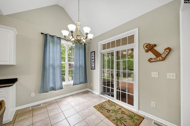124 Pond Edge Ln, Chapin, SC 29036 - unfurnished dining area with baseboards, vaulted ceiling, a chandelier, light tile patterned flooring, and visible vents