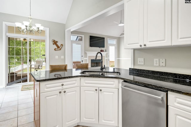 124 Pond Edge Ln, Chapin, SC 29036 - kitchen with vaulted ceiling, a peninsula, dishwasher, ceiling fan with notable chandelier, and a sink