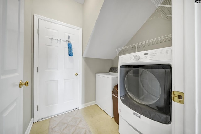 124 Pond Edge Ln, Chapin, SC 29036 - laundry room with light tile patterned floors, washer and clothes dryer, laundry area, and baseboards