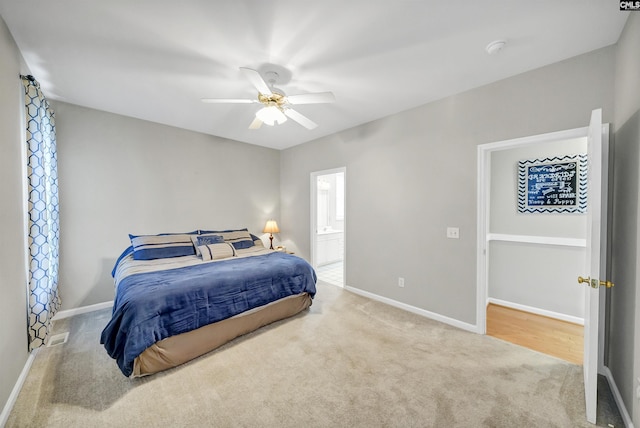 124 Pond Edge Ln, Chapin, SC 29036 - carpeted bedroom with baseboards, connected bathroom, and ceiling fan