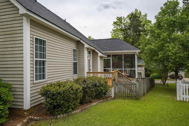 124 Pond Edge Ln, Chapin, SC 29036 - rear view of house with a deck, a sunroom, a lawn, fence, and roof with shingles