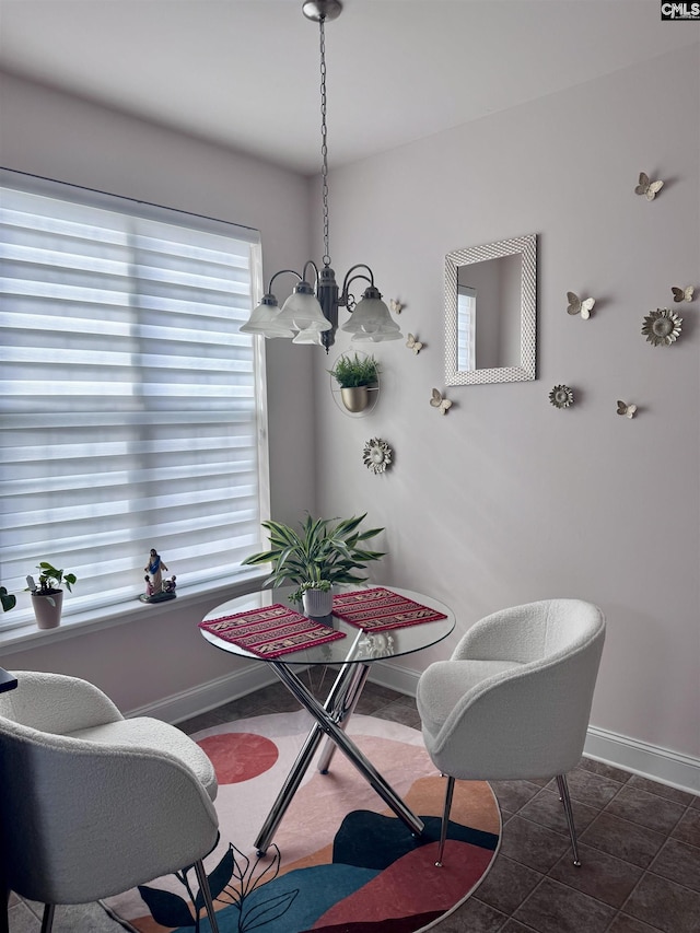 41 Carlisle Ln, Camden, SC 29020 - dining room featuring a chandelier, baseboards, and dark tile patterned flooring