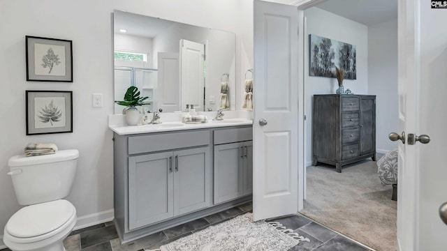 118A Willow Creek Blvd, Lugoff, SC 29078 - bathroom with baseboards, a sink, toilet, double vanity, and a stall shower