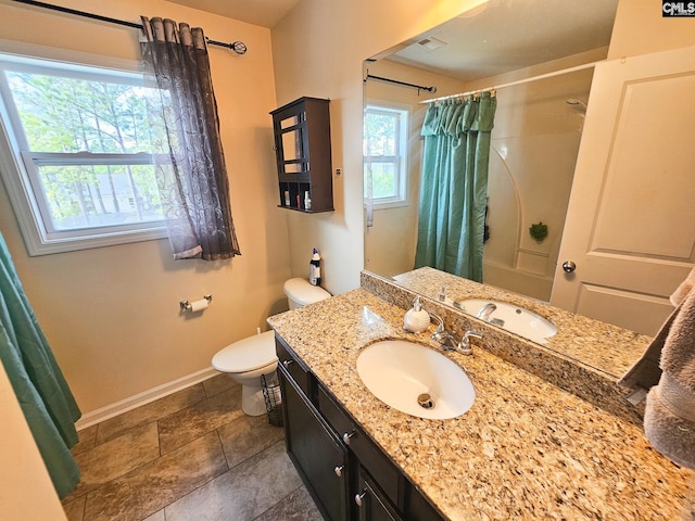 56 Kimpton Dr, Elgin, SC 29045 - bathroom with toilet, a shower with curtain, plenty of natural light, and baseboards