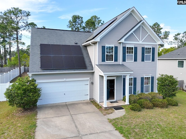 56 Kimpton Dr, Elgin, SC 29045 - view of front of home with a garage, a front yard, fence, solar panels, and driveway