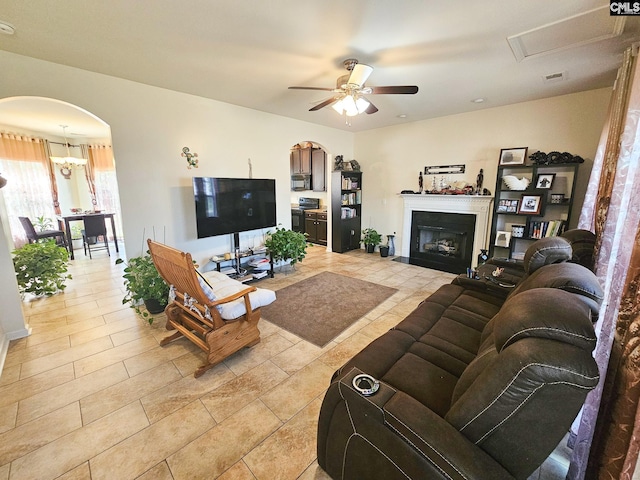 56 Kimpton Dr, Elgin, SC 29045 - living area with arched walkways, a fireplace, and a ceiling fan