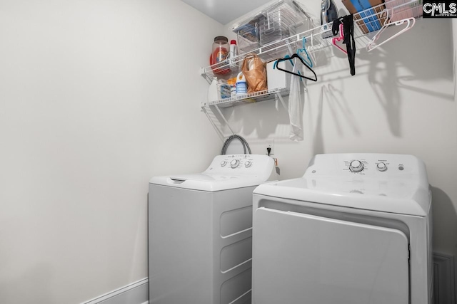washroom with laundry area and washing machine and dryer