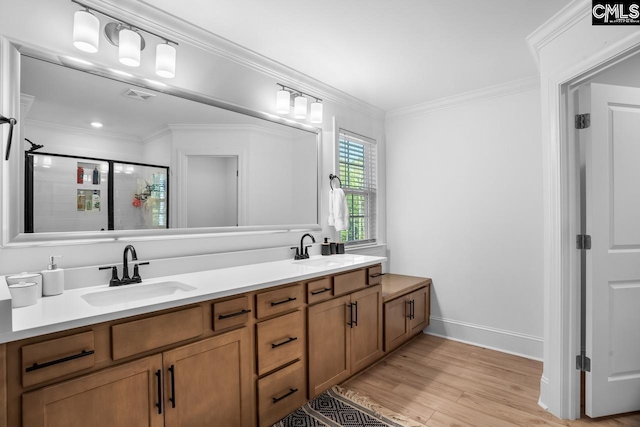full bath featuring visible vents, wood finished floors, a stall shower, and a sink