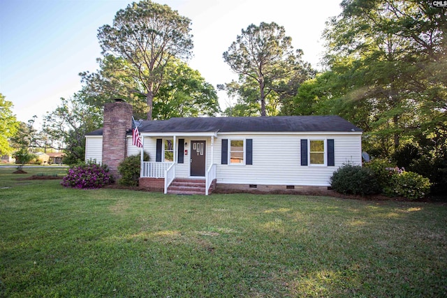 view of front facade with crawl space, a chimney, and a front yard