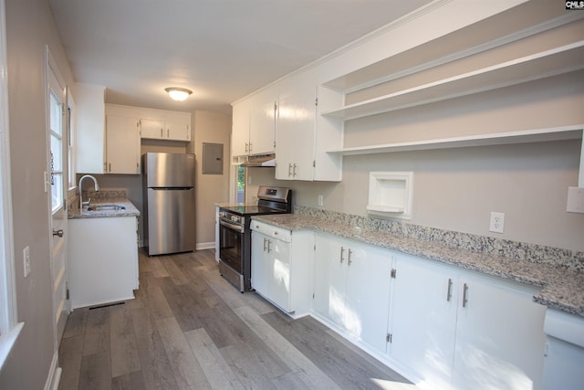 kitchen featuring open shelves, a sink, under cabinet range hood, stainless steel appliances, and dark wood-type flooring