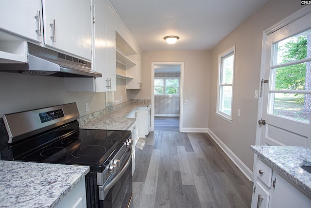 kitchen with white cabinets, open shelves, under cabinet range hood, wood finished floors, and stainless steel electric range