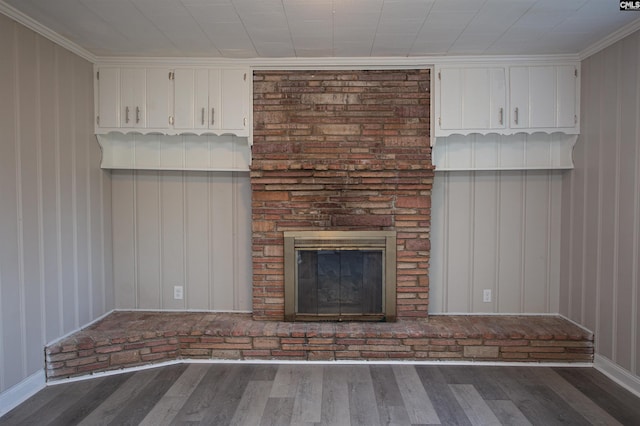 unfurnished living room with wood finished floors and a fireplace