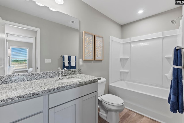 1071 Cornelia St, Elgin, SC 29045 - full bath featuring visible vents, toilet, vanity, wood finished floors, and shower / bathtub combination