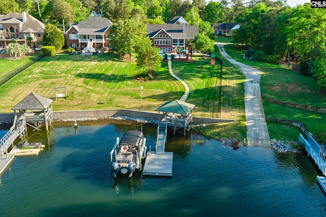 209 Mariannas Ct, Lexington, SC 29072 - view of dock with boat lift, a yard, and a water view