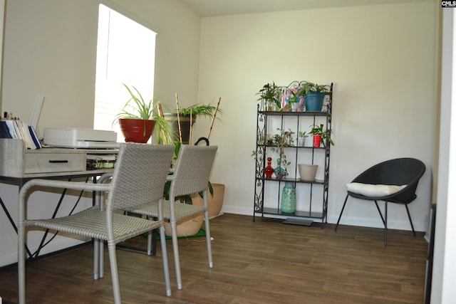 dining room featuring baseboards and wood finished floors