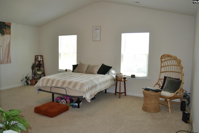 bedroom with baseboards, carpet, and vaulted ceiling