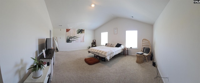 bedroom featuring baseboards, carpet, and vaulted ceiling