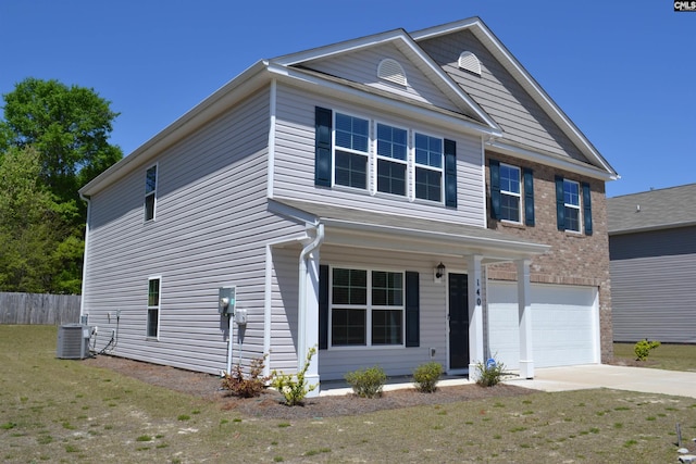 view of front of property featuring central AC, a front lawn, brick siding, an attached garage, and driveway