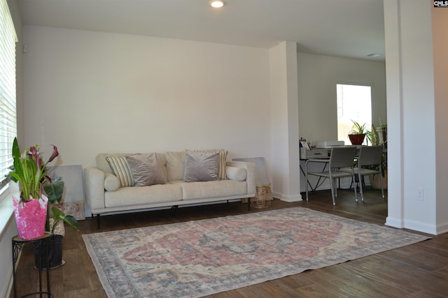 living area featuring recessed lighting, baseboards, and wood finished floors