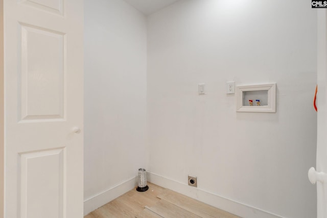 laundry room with laundry area, electric dryer hookup, washer hookup, light wood finished floors, and baseboards