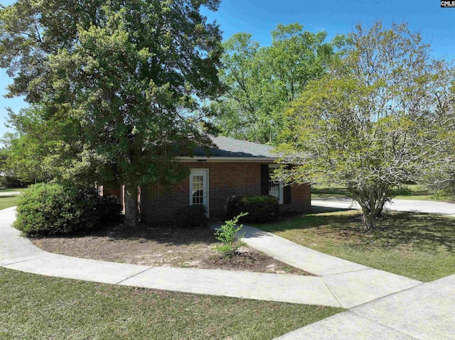 325 Third Ave, Lexington, SC 29072 - view of home's exterior with a yard and brick siding