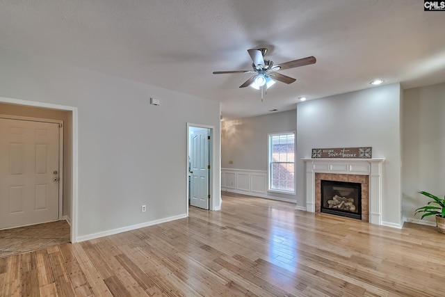 113 Wild Spring Rd, Lexington, SC 29072 - unfurnished living room with a decorative wall, ceiling fan, light wood-style floors, a fireplace, and recessed lighting