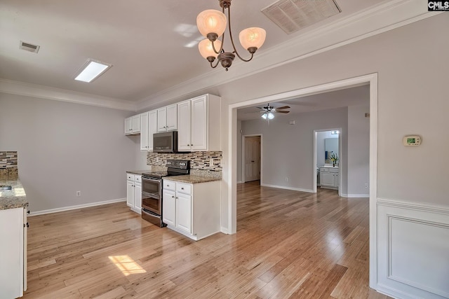113 Wild Spring Rd, Lexington, SC 29072 - kitchen with stainless steel appliances, visible vents, white cabinetry, and ornamental molding