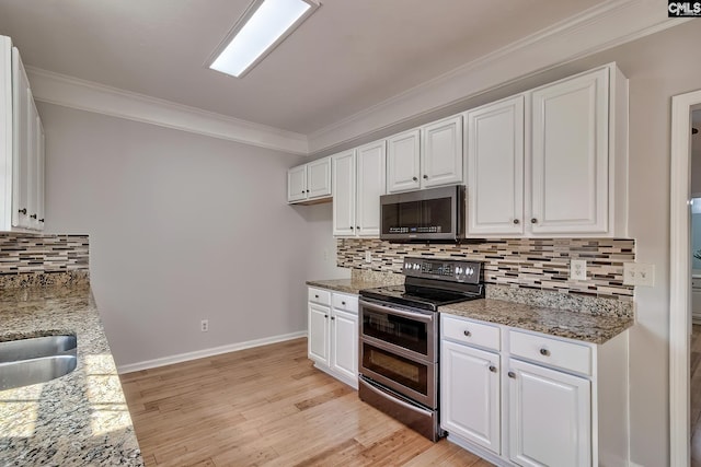 113 Wild Spring Rd, Lexington, SC 29072 - kitchen featuring crown molding, white cabinetry, and stainless steel appliances