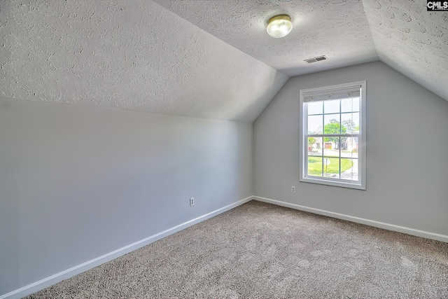 113 Wild Spring Rd, Lexington, SC 29072 - bonus room featuring baseboards, carpet flooring, a textured ceiling, visible vents, and lofted ceiling