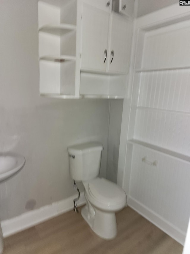 303 Southview Dr, Laurens, SC 29360 - bathroom featuring toilet, baseboards, and wood finished floors
