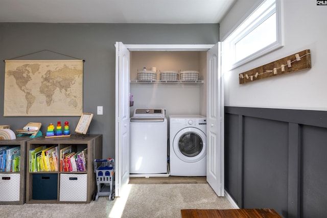 laundry area featuring laundry area, washing machine and clothes dryer, and carpet