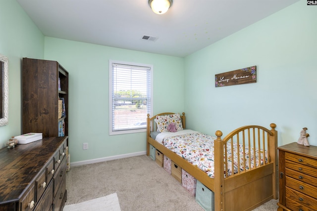 bedroom featuring light carpet, visible vents, and baseboards